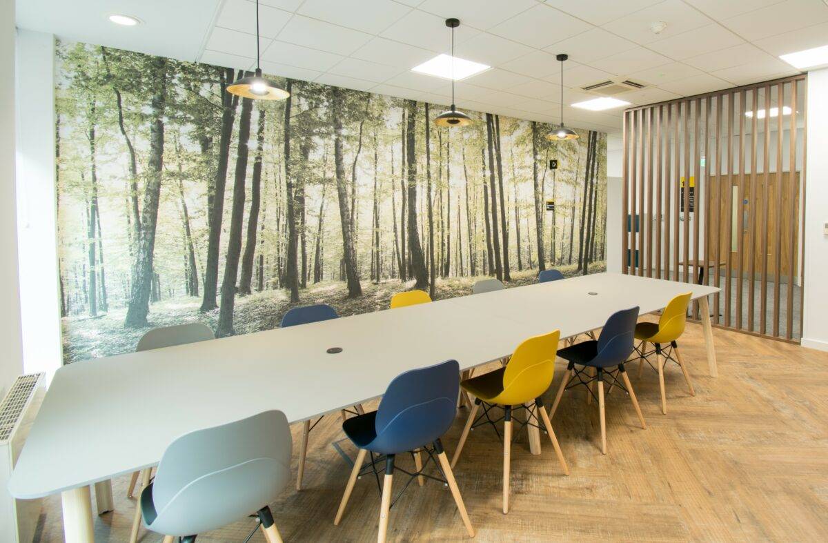 Office board room with different colour chairs.